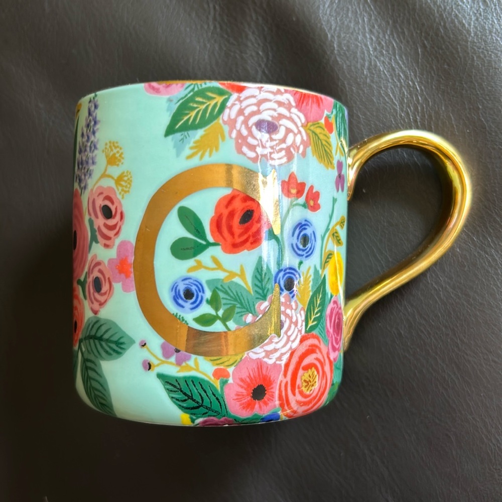 Rifle Paper Co floral mug with gold handle and “C” monogram.